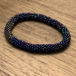 Woman’s beaded women together metallic bracket